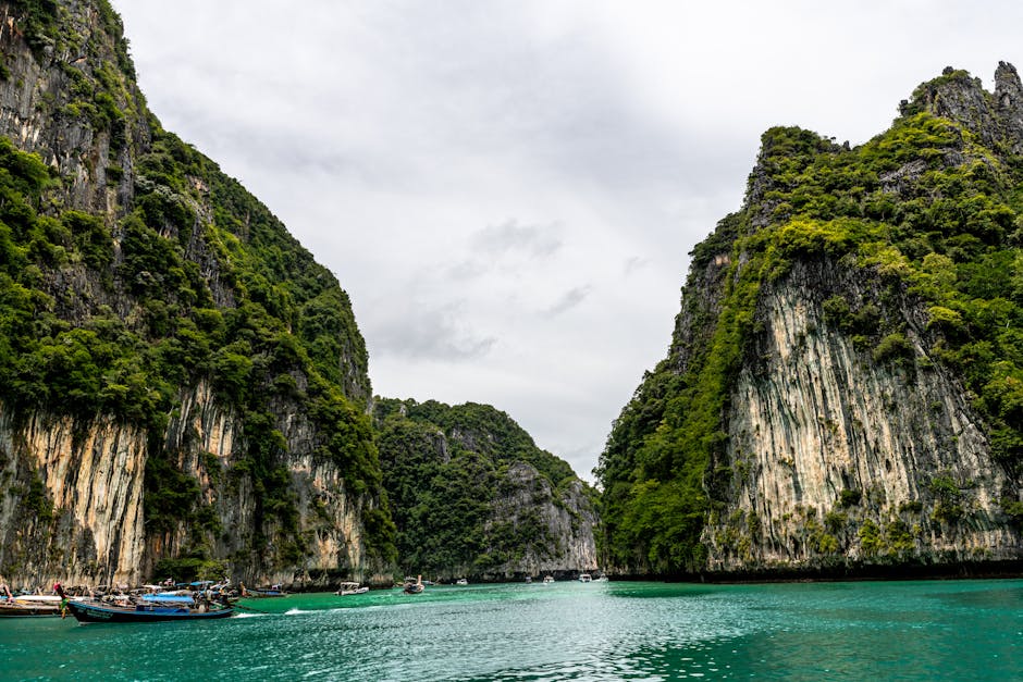 Stunning view of emerald waters surrounded by cliffs in Phuket, Thailand.